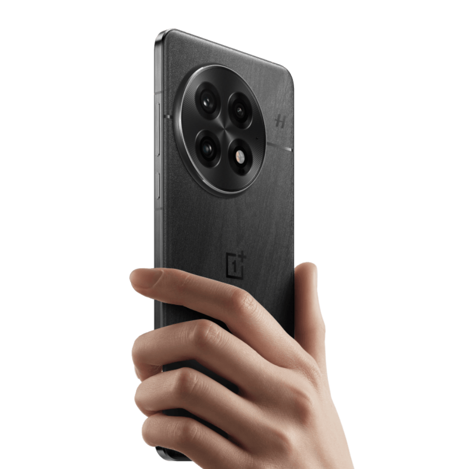 Hand holding a black smartphone with a clear background