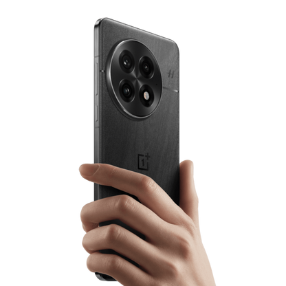 Hand holding a black smartphone with a clear background