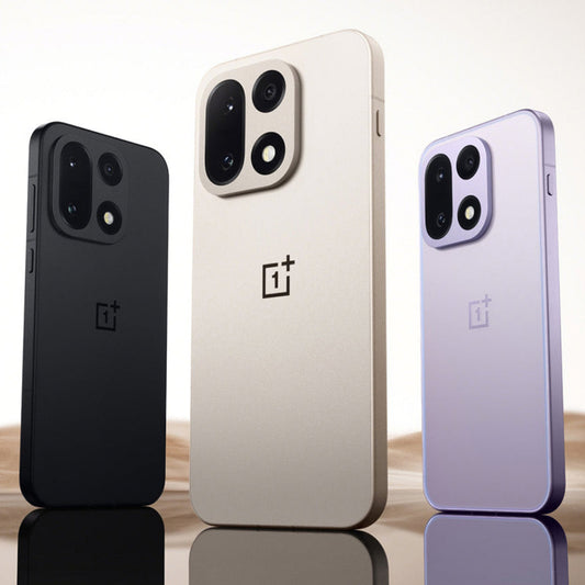 Three OnePlus smartphones in black Sand Storm, and purple on a reflective surface with desert background