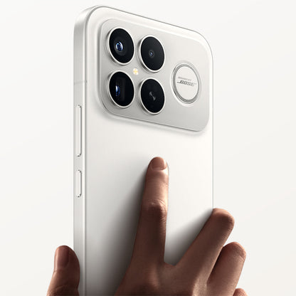 White Redmi K90 Pro Max smartphone held by a hand with a plain background