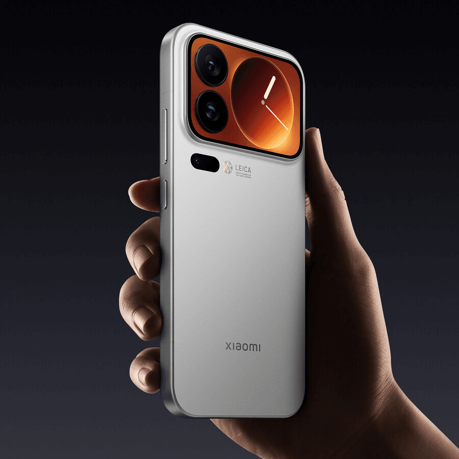 Hand holding a White Xiaomi 17 Pro smartphone with a dark background