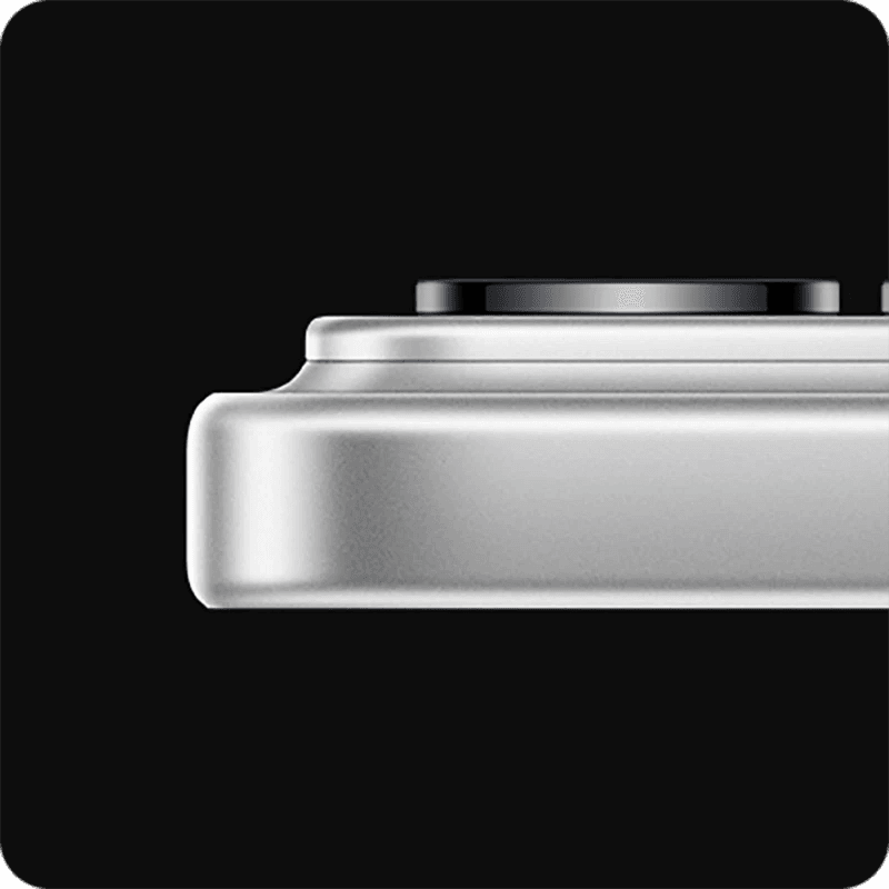 Close-up of a metallic White Xiaomi 17 Pro smartphone from the side showing camera module and the phone at its thickest point with a black background