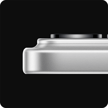 Close-up of a metallic White Xiaomi 17 Pro smartphone from the side showing camera module and the phone at its thickest point with a black background
